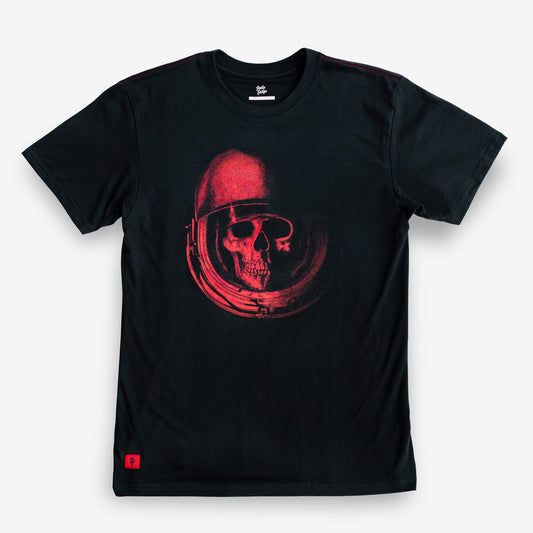 A black short-sleeve crewneck t-shirt featuring a red graphic print of a skull inside an astronaut helmet on the chest, displayed flat against a light gray background.