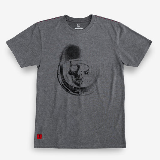 A heather gray crewneck t-shirt featuring a black graphic print of a skull inside an astronaut helmet on the front. A small red square logo is visible on the bottom left hem.