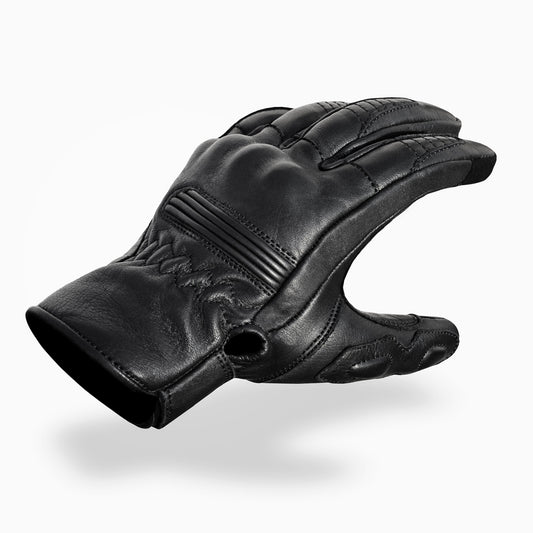 Black leather glove on a white background