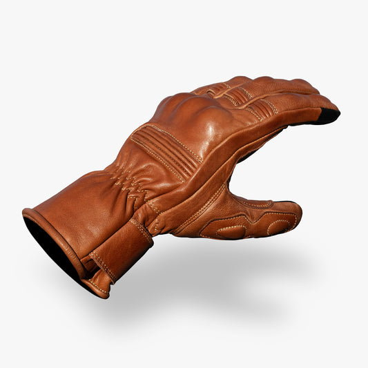 Golden brown leather glove on a white background.