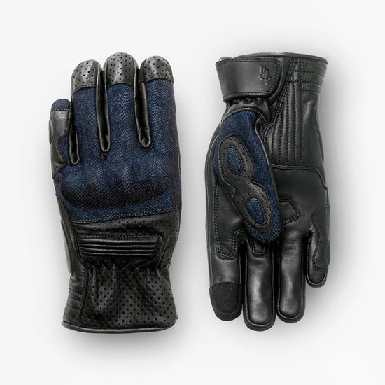 Pair of black and blue gloves on a white background